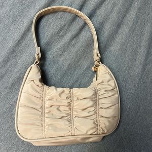 Ruffled tan purse